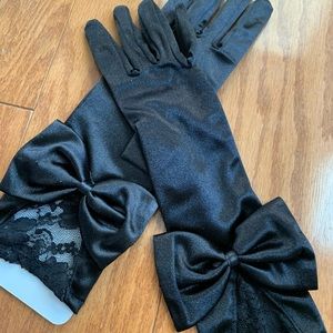 Black arm gloves with bow tie and lace. Brand new
